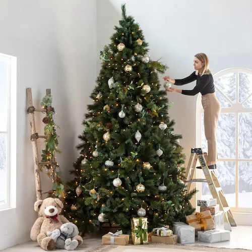 Decorating the Sherwood 10ft Christmas Tree from EZ Living Furniture. 