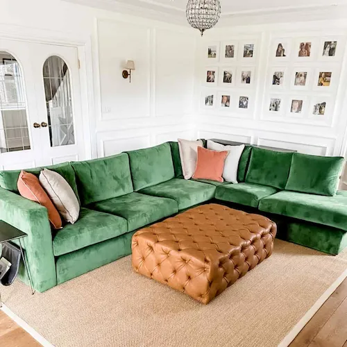 Wild & Rosie Living Room design with green velvet sofa.