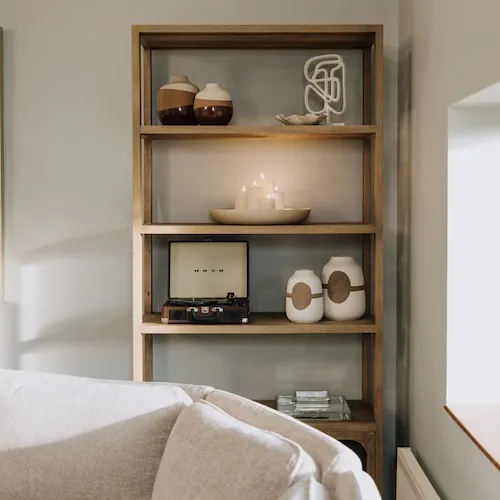Decorative shelf with accessories including Banda Shell Dish at EZ Living Furniture.