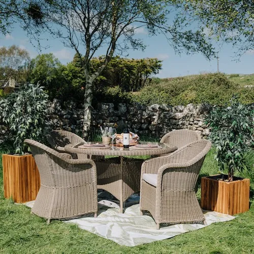 Seville Round Garden Dining Table & Round Dining Chairs at EZ Living Furniture.