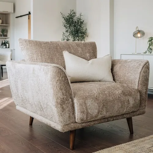 Boutique Silver Crushed Velvet Feel Cuddler Armchair at EZ Living Furniture.
