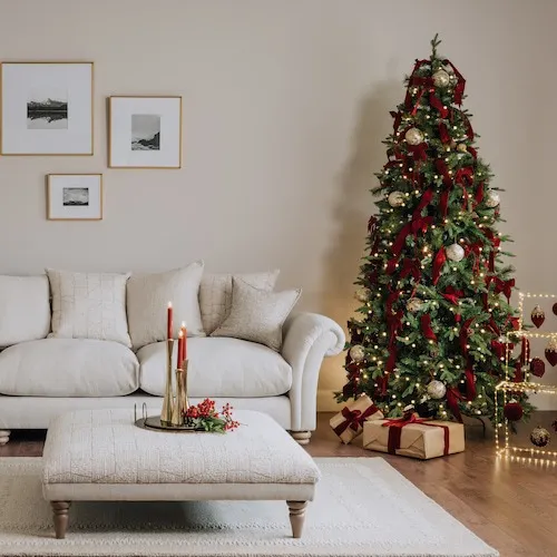 Red and gold Christmas tree theme at EZ Living Furniture.