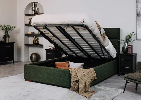 Ebony green fabric ottoman bed on the lifestyle photo with open storage